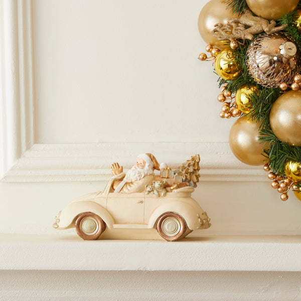 PAPAI NOEL NO CARRO DOURADO